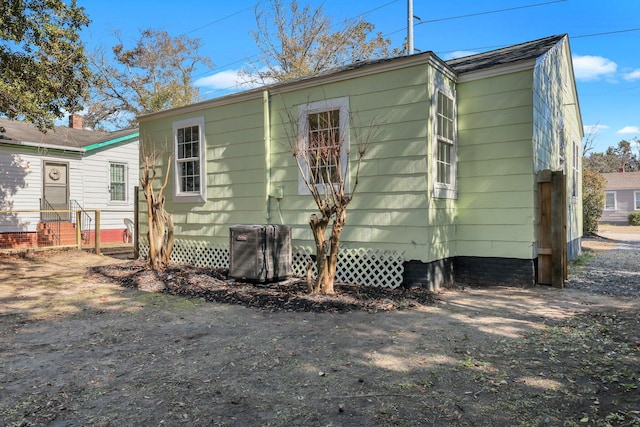 back of property with central air condition unit