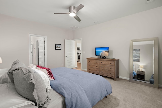 bedroom with baseboards, light carpet, and a ceiling fan