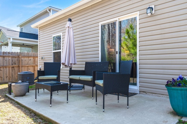 view of patio featuring fence