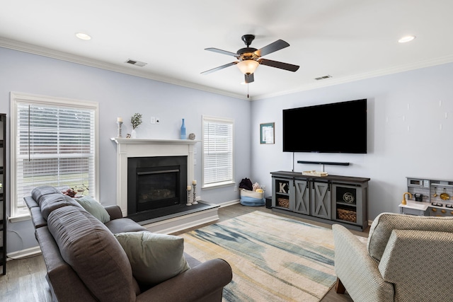 8402 Loggers Run, North Charleston, SC 29420 - living room with a ceiling fan, wood finished floors, crown molding, baseboards, and a fireplace with raised hearth