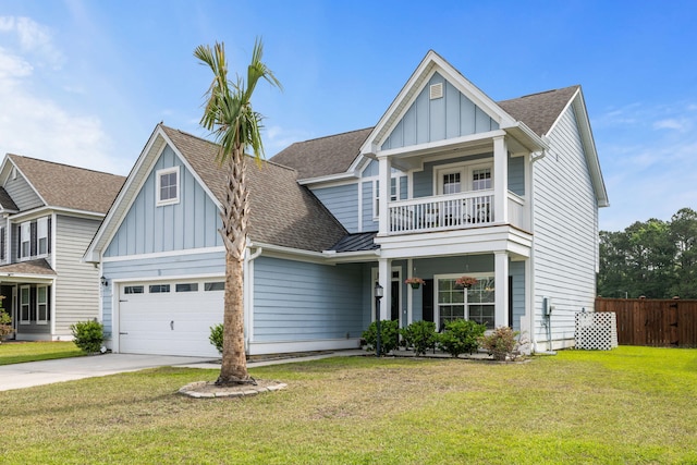 8402 Loggers Run, North Charleston, SC 29420 - view of front of home with board and batten siding, a shingled roof, driveway, a balcony, and a garage
