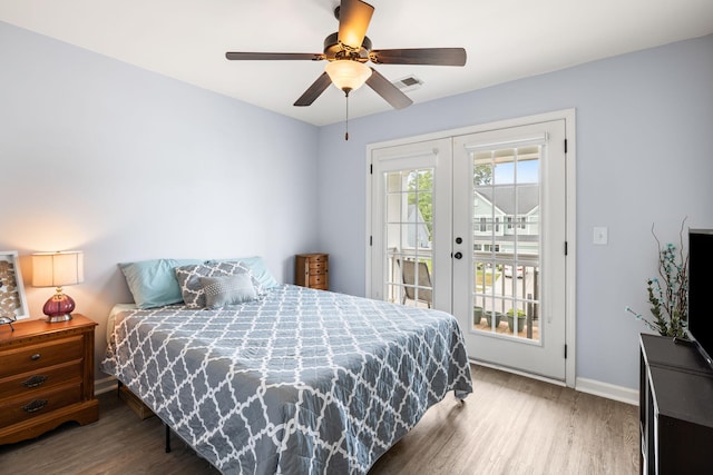 8402 Loggers Run, North Charleston, SC 29420 - bedroom with french doors, access to exterior, wood finished floors, and baseboards