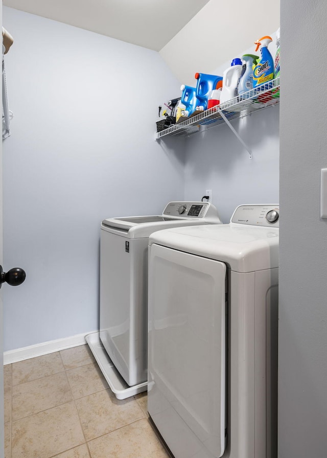 8402 Loggers Run, North Charleston, SC 29420 - clothes washing area with washing machine and clothes dryer, light tile patterned floors, and baseboards