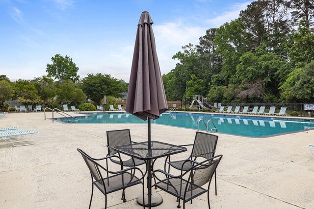 8402 Loggers Run, North Charleston, SC 29420 - community pool featuring fence and a patio area