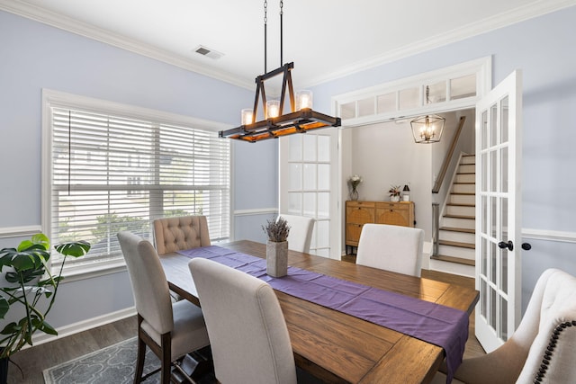 8402 Loggers Run, North Charleston, SC 29420 - dining room featuring a chandelier, crown molding, stairs, wood finished floors, and baseboards