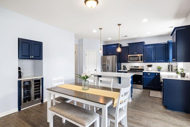8402 Loggers Run, North Charleston, SC 29420 - dining room with wine cooler, dark wood-style flooring, recessed lighting, and baseboards