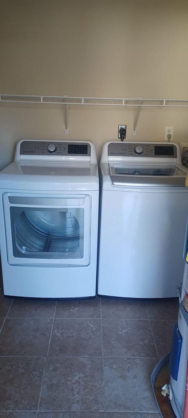 laundry room featuring washing machine and clothes dryer