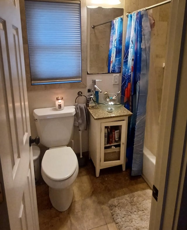 bathroom with tile patterned floors, toilet, and shower / bathtub combination with curtain