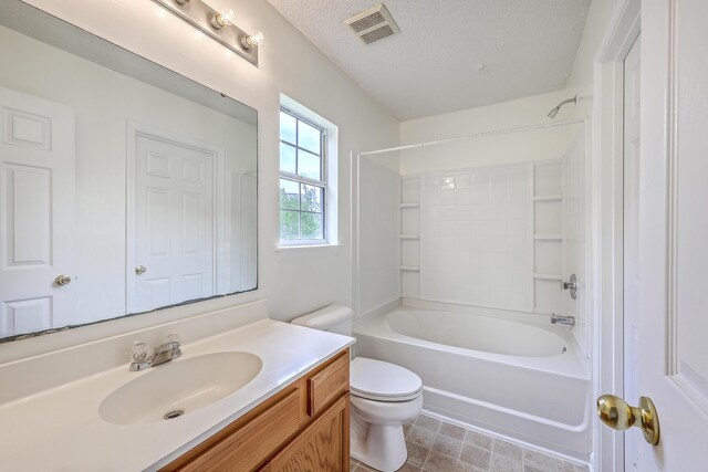 206 Barnwell St, Summerville, SC 29483 - bathroom with toilet, vanity, bathtub / shower combination, and a textured ceiling