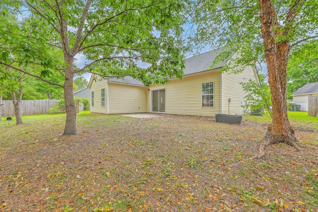 206 Barnwell St, Summerville, SC 29483 - back of house with fence, a shingled roof, and a patio