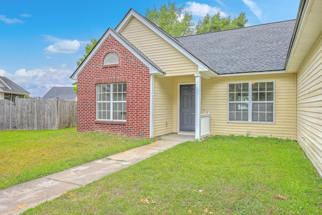 206 Barnwell St, Summerville, SC 29483 - view of front of home with roof with shingles and brick siding