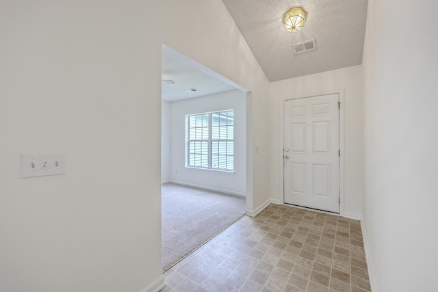 206 Barnwell St, Summerville, SC 29483 - foyer entrance with a textured ceiling, baseboards, and light colored carpet