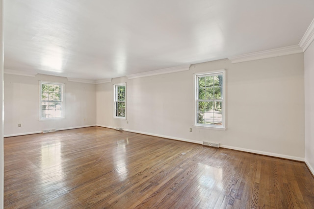 unfurnished room with dark hardwood / wood-style flooring and ornamental molding