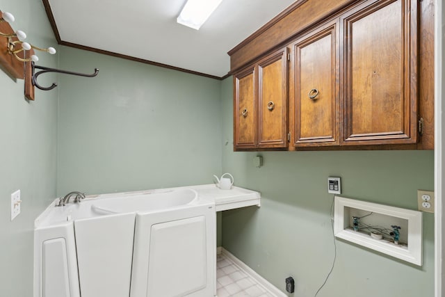 laundry room featuring hookup for a washing machine, cabinets, and ornamental molding