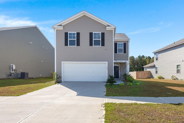 view of front facade with a front yard and a garage