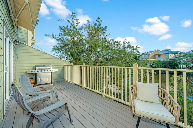 wooden terrace with a grill