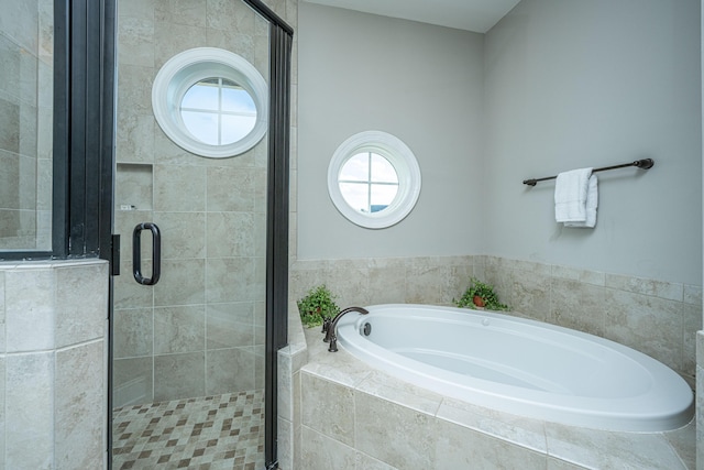 full bath with a shower stall and a bath
