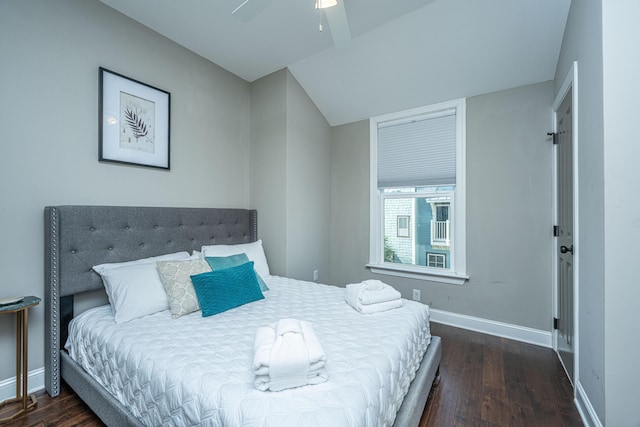 bedroom featuring wood finished floors, baseboards, and a ceiling fan