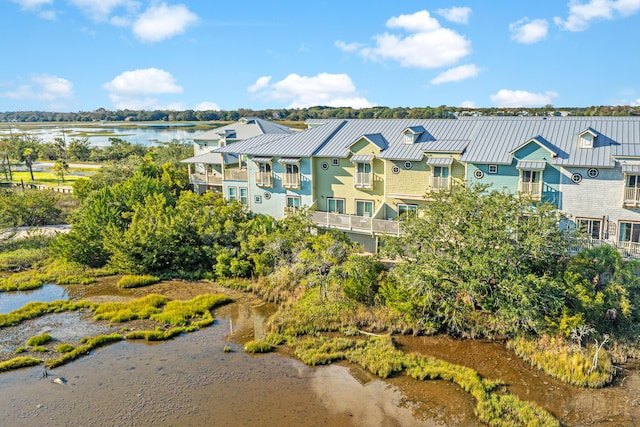 drone / aerial view featuring a residential view and a water view