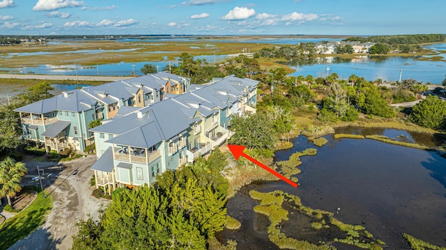 birds eye view of property featuring a residential view and a water view