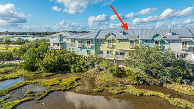 birds eye view of property featuring a residential view and a water view