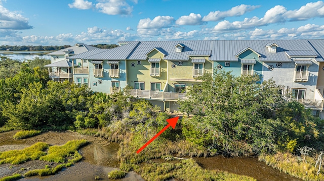 aerial view with a water view and a residential view