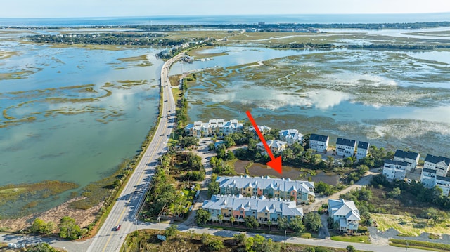 bird's eye view with a residential view and a water view