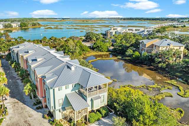 drone / aerial view featuring a water view and a residential view