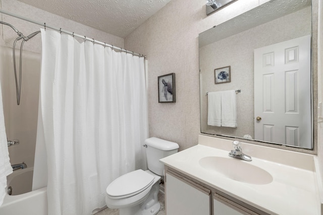 full bathroom with vanity, toilet, a textured ceiling, and shower / bath combo with shower curtain