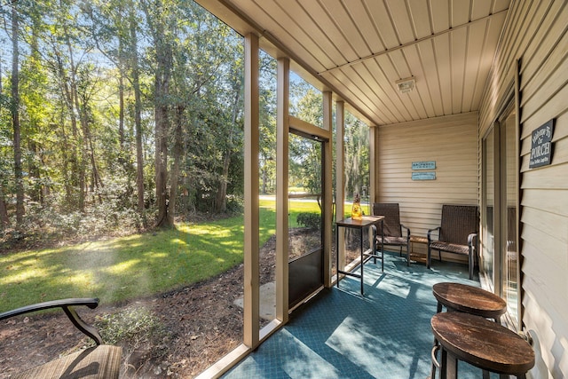 sunroom / solarium with wooden ceiling