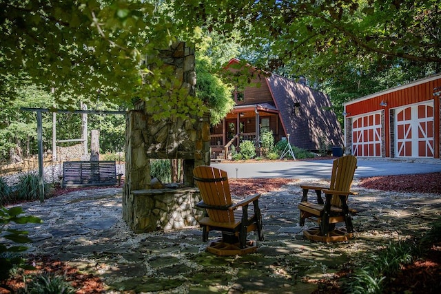 view of patio with an outbuilding