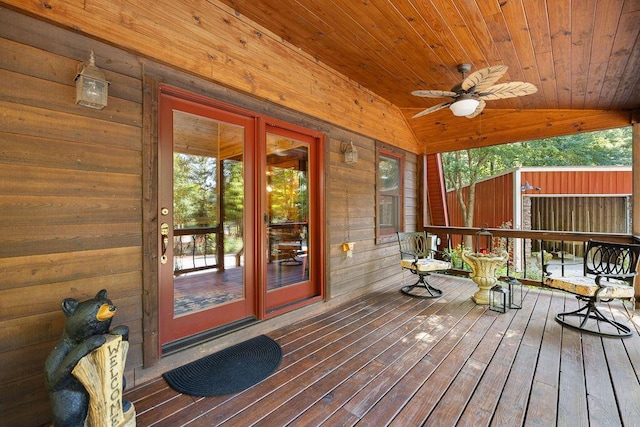 wooden deck featuring ceiling fan and a porch