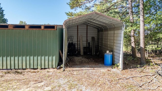 view of outbuilding with a carport