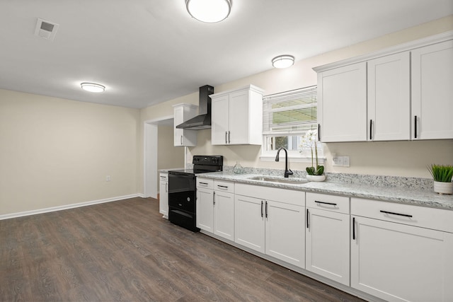 kitchen featuring electric range, a sink, wall chimney range hood, white cabinets, and dark wood-type flooring