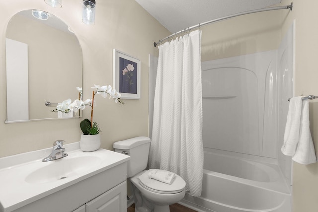 full bath with toilet, vanity, and shower / bath combo with shower curtain