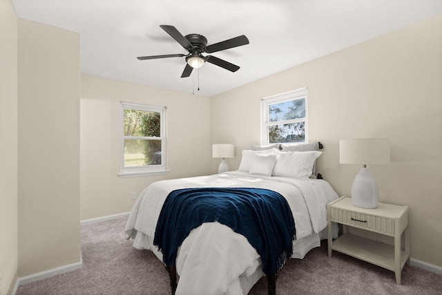 bedroom featuring carpet, baseboards, and a ceiling fan