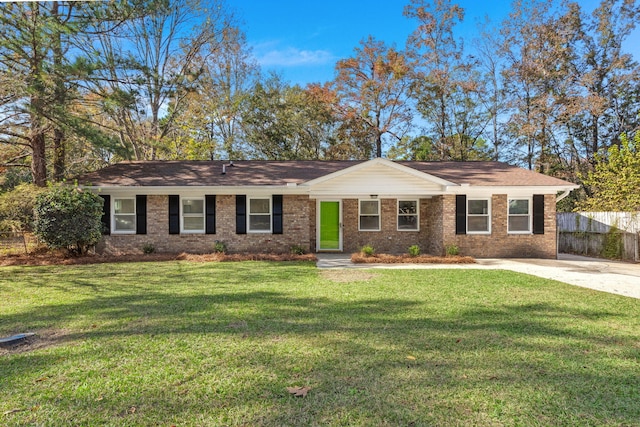 ranch-style house featuring brick siding
