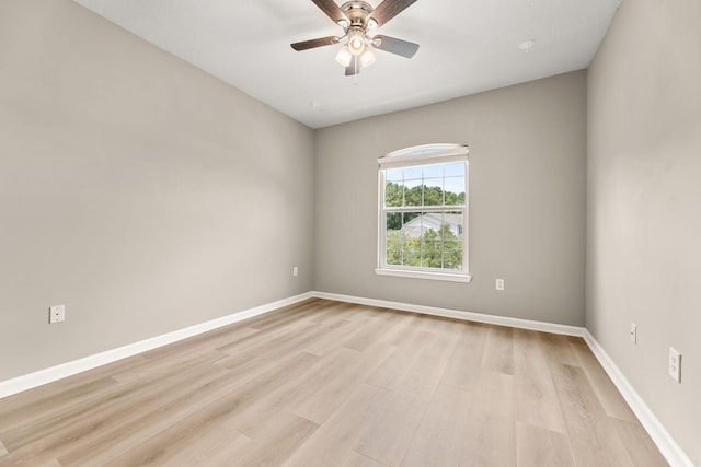 unfurnished room featuring ceiling fan and light wood-type flooring