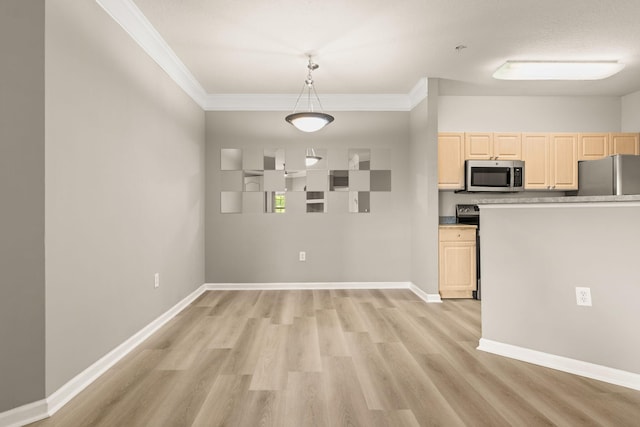 kitchen featuring pendant lighting, stainless steel appliances, crown molding, and light hardwood / wood-style floors