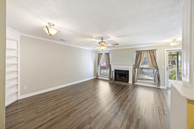 unfurnished living room with crown molding, dark hardwood / wood-style flooring, ceiling fan, and a textured ceiling