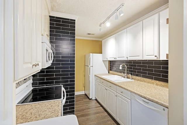 kitchen featuring white appliances, white cabinetry, dark wood-type flooring, and sink