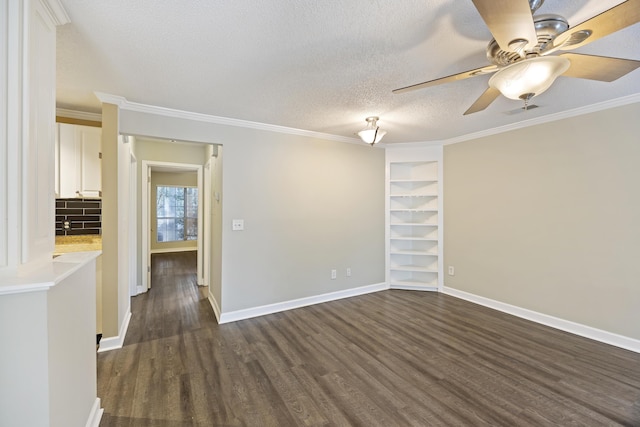 spare room featuring a textured ceiling, dark hardwood / wood-style floors, ceiling fan, and crown molding