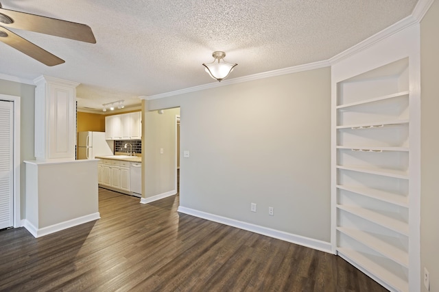 interior space with a textured ceiling, dark hardwood / wood-style flooring, ceiling fan, and ornamental molding