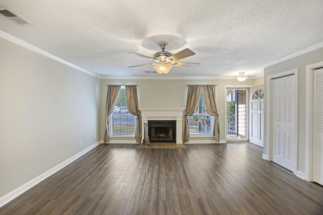 unfurnished living room featuring a textured ceiling, crown molding, ceiling fan, and dark wood-type flooring