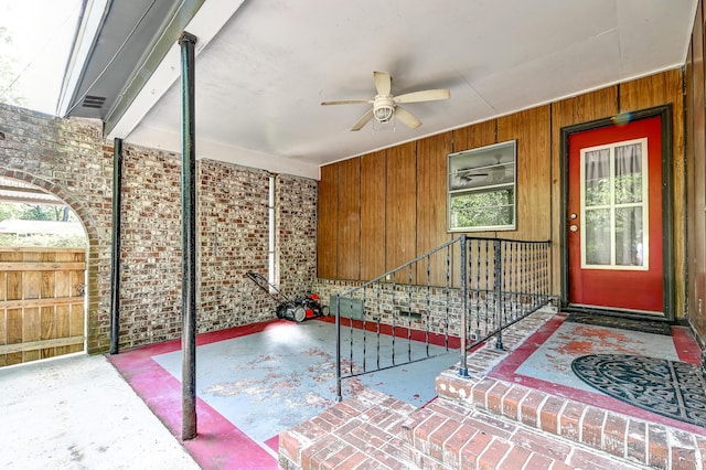 view of patio / terrace with ceiling fan and fence