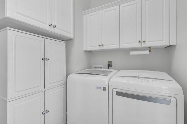 laundry area featuring cabinet space and washer and dryer