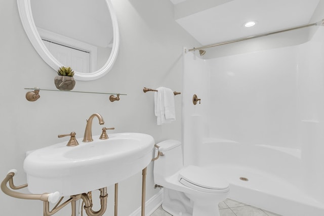 full bathroom featuring toilet, a shower stall, and tile patterned floors