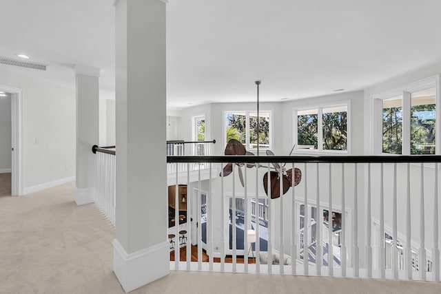 corridor with baseboards, recessed lighting, visible vents, and light colored carpet