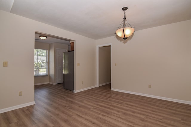 empty room with dark wood-type flooring