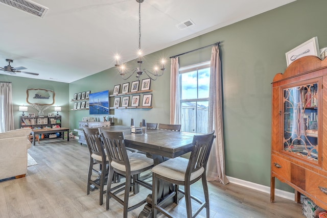 302 Fox Gap Rd, Summerville, SC 29486 - dining room with visible vents, baseboards, light wood-type flooring, and ceiling fan with notable chandelier